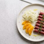 Involtini di bresaola con ricotta alle erbe, finocchio e arancia